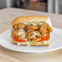Shrimp Po Boy · Gulf shrimp fried to a nice golden crisp . Dressed and drizzled with our remoulade sauce.