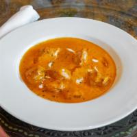 Butter Chicken · Savory yogurt marinated breast of chicken baked and then simmered in a tomato butter sauce f...