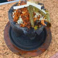 Molcajete · Shrimp, chicken, steak, chorizo, cactus, cheese, jalapeno and onions. Includes Rice,Beans, s...