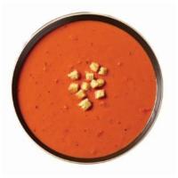 Creamy Tomato Soup · a delicious medley of tomatoes, light cream, spices and garlic all simmered in a rich broth....