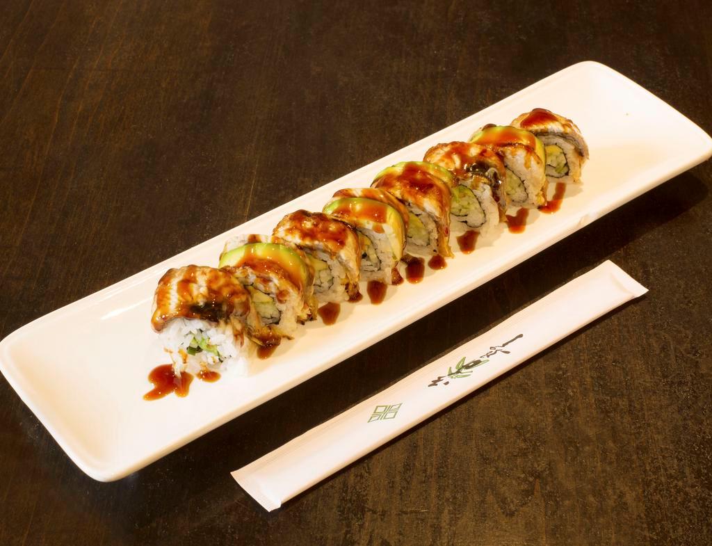 M21. Dragon Roll · California topped with smoked eel and avocado.
