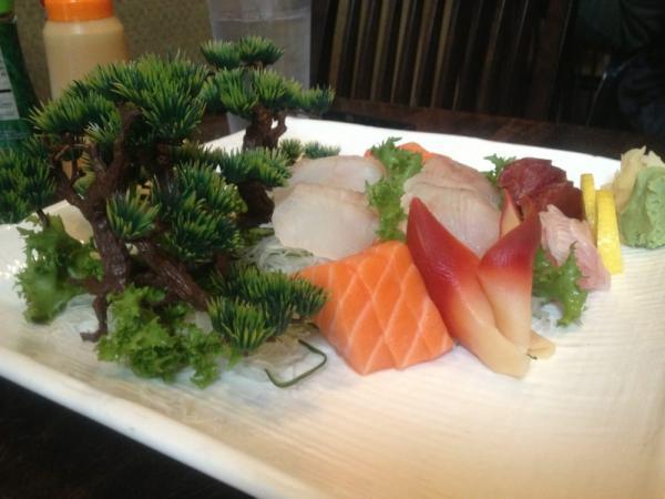 S5. Sashimi Deluxe · 30 pieces assorted slices of raw fish. Served with miso soup and salad.