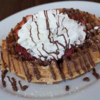 Nutellatastic Waffle · Waffle, Nutella, bananas, strawberries and whipped cream.