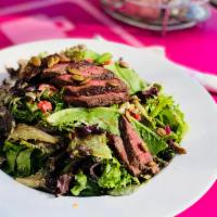 K24 Steak Salad · Angus top sirloin, organic greens, onions, roasted pepitas, roasted red peppers, grape tomat...