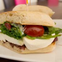 Caprese Sandwich · Fresh mozzarella, arugula, tomato and balsamic dressing. Served with French fries.
