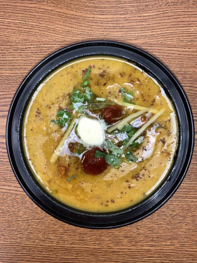 Daal Mahrani (Lentil) with Rice · Made Using Mixture of Red and Yellow Lentils, Butter, Onions, Ginger- Garlic Paste, Cilantro, Green Chilli, Ginger Slices, Cumin, black pepper, Turmeric powder, Red chili powder, Whole red peppers and In House Special mix spices. Lentils Soup Curry. Cooked well done!