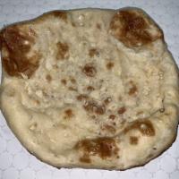 Garlic Naan Bread · Made using Pillsbury hi gluten flour, Milk, Crushed Garlic and In House Special Ingredient.