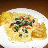 La Bamba Pasta · Creamy Cajun sauce tossed with tomatoes and black olives over linguine.