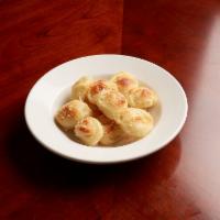 Garlic Knots · Fresh homemade breaded knots brushed with fresh garlic and extra virgin olive oil. Topped wi...