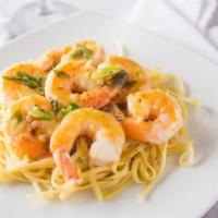 Shrimp Scampi · Jumbo shrimp and shallots sautéed in a white wine and garlic butter sauce over linguine.