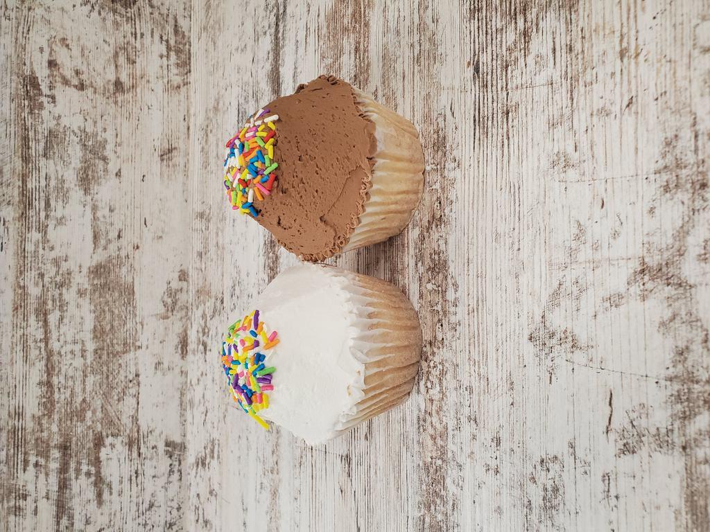 White Cupcake · White cake with your choice of white or chocolate buttercream icing topped with sprinkles.