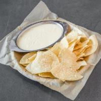 Chips-N-Queso · Thinly sliced and crispy with melted cheese. 