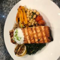 Citrus Salmon Bowl · Cumin-scented Greek yogurt-topped grilled salmon over sautéed Tuscan kale, a hearty blend of...