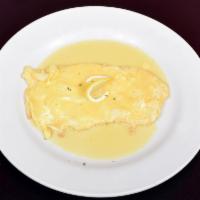 Francese · Egg battered and sauteed in a wine and butter sauce.