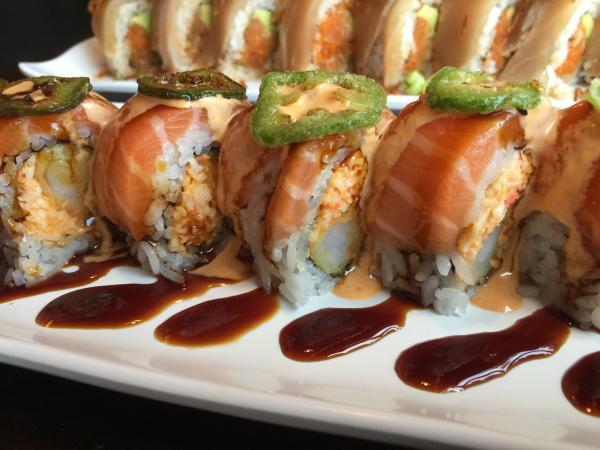 NoHo Roll · Shrimp tempura and spicy crab inside with salmon, deep fried jalapeno, spicy mayo, and eel sauce outside.