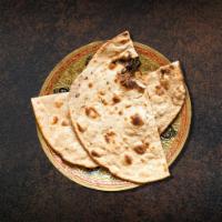 Clay Oven Baked Flatbread · Whole wheat flat bread baked to perfection in an Indian clay oven.
