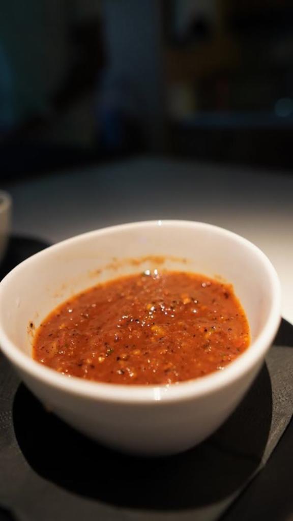 Salsa Roja · Red house-made salsa with tomatoes, guajillo, chipotle, onion, garlic, and jalapenos. Hot in spice.