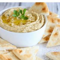 Garlic Hummus With Pita · Mashed chickpeas, garlic sauce, lemon juice, tahini sauce, special spices topped with olive ...