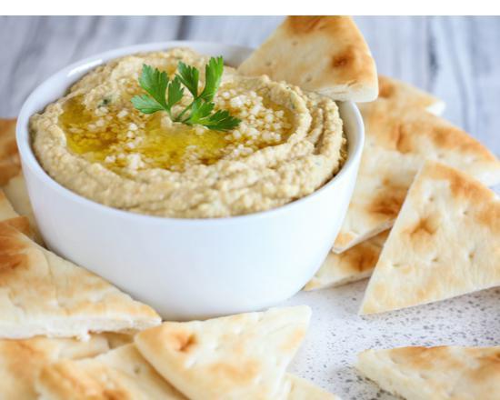 Garlic Hummus With Pita · Mashed chickpeas, garlic sauce, lemon juice, tahini sauce, special spices topped with olive oil. Add protein for an additional charge.