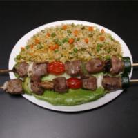 Lamb Kabob Entree · Marinated pieces of lamb grilled to perfection, served with rice and grilled vegetables.