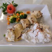 Malai Tikka Kebab  · Boneless marinated chicken in cream, yogurt and spices. Gluten free.