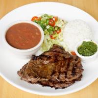 Entrana a la Plancha · 8 oz. grilled skirt steak marinated with traditional Latin herbs and spices, served with whi...