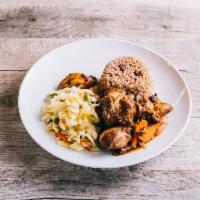 Brown Stew Chicken · Served with a choice of rice and peas, or white rice with vegetables and plantain.