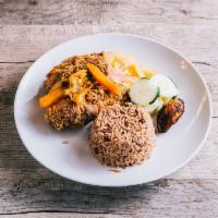 Fried Chicken · Served with a choice of rice and peas, or white rice with vegetables and plantain.