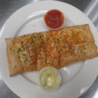 Cheezy Bread · Fresh baked bread strips with mozzarella cheese and garlic butter. Topped with cheddar chees...