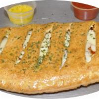 Pepperoni Calzone · Ricotta cheese, mozzarella cheese and pepperoni. Served with marinara dipping sauce.