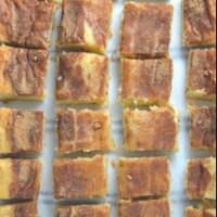 10% OFF Cinnamon Squares · Fresh baked buttery pastry topped with cinnamon sugar with a side of vanilla icing.
