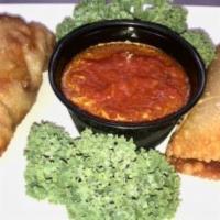 Pizza Logs · Pepperoni, mozzarella cheese and pizza sauce rolled up in egg roll wrappers and deep fried. ...