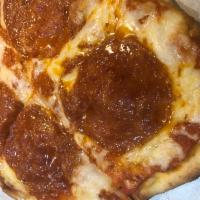 Italian Flatbread · Tomato sauce, mozzarella cheese and pepperoni.  Served with a side salad