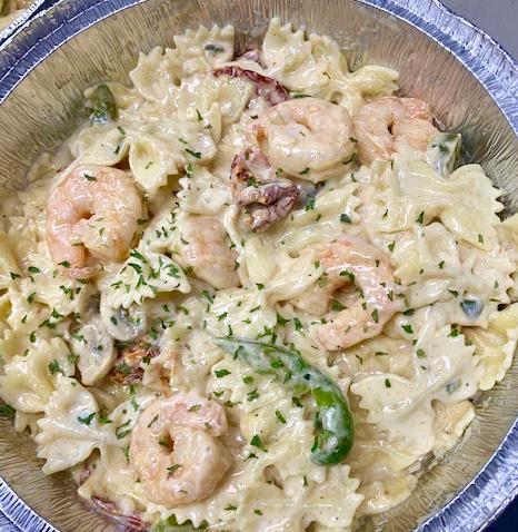 Latitudes Pasta · Bow tie pasta with sautéed chicken, mushrooms, green peppers and sun-dried tomatoes tossed in our Cajun Cream Sauce.  Served with fresh bread and a salad   Add shrimp for additional $$