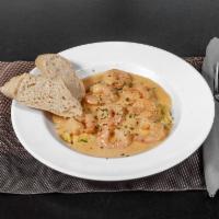 Shrimp & Grits · Sautéed shrimp with stone ground grits in our Cajun cream sauce..
Served with a side salad a...