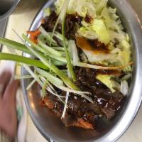 Beef Bulgogi Bowl · Rice topped with thinly sliced Ribeye Steak, shredded lettuce, carrots, kimchi drizzled with...