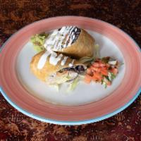 Chicken Chimichanga · Rolled flour tortilla, deep fried served with cheese, lettuce, black bean and pico de gallo ...