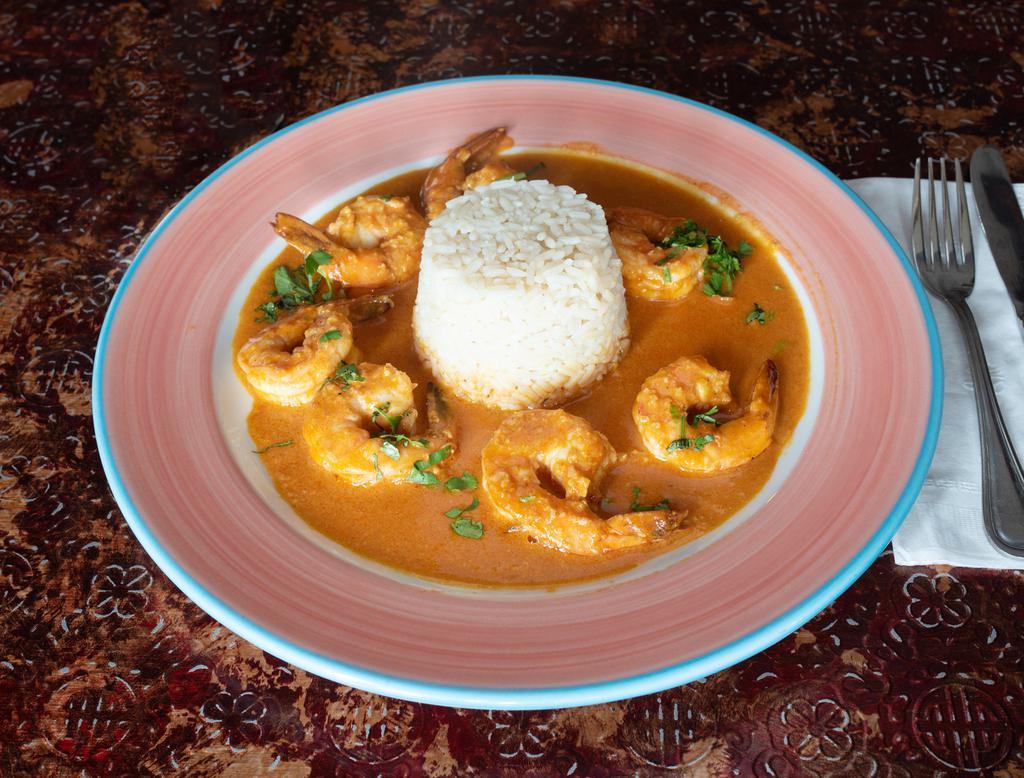 Camarones al Ajillo · Shrimp sauteed with hot dried chilies in a garlic and white wine sauce. Served with white rice.