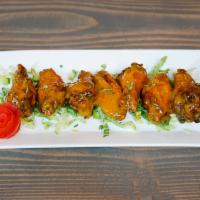 Maple Habanero Chicken Wings · Six crispy chicken wings tossed in our house made maple habenero sauce.