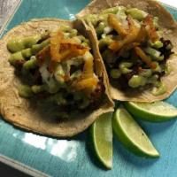 Al Pastor (Pork) (two tacos) · Two Al Pastor (pork) tacos , cilantro, grilled pineapple, onions, avocado sauce.