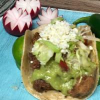 Two Grilled Chili-Lime Chicken Tacos (two tacos) · Topped with onion, cilantro and avocado sauce