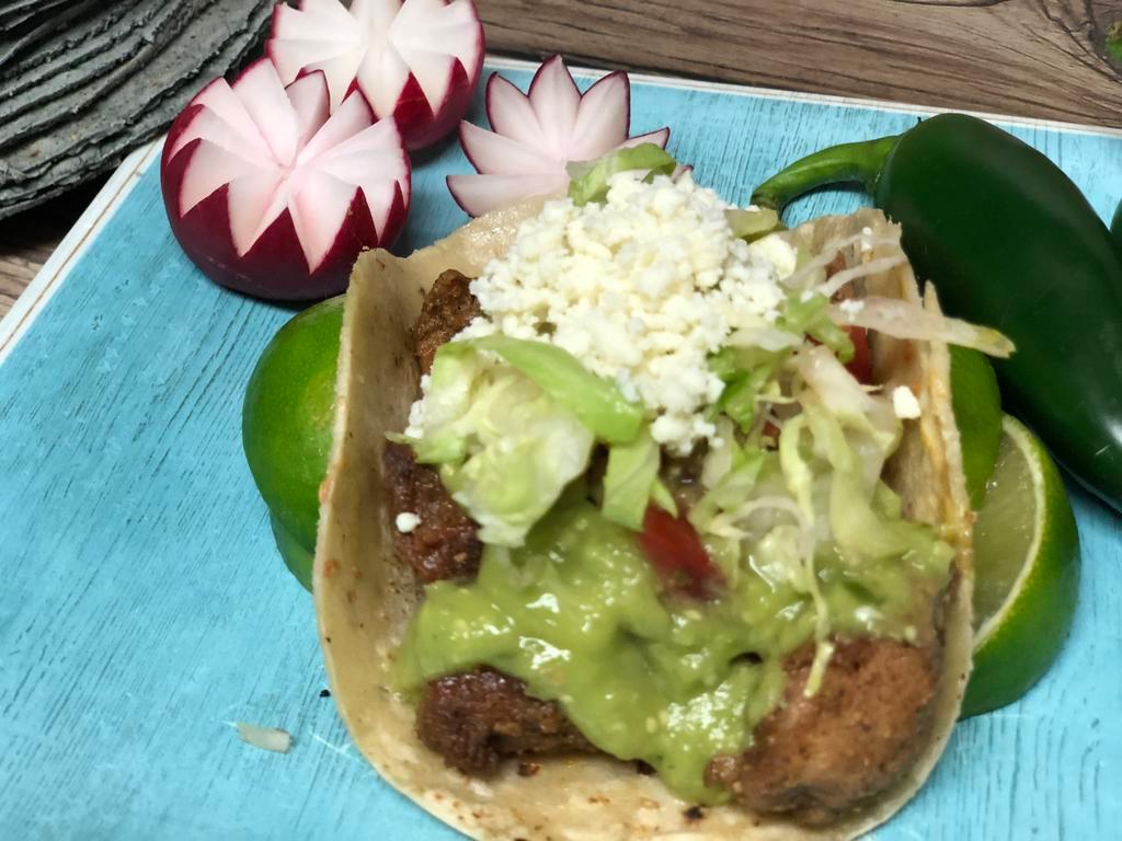 Two Grilled Chili-Lime Chicken Tacos (two tacos) · Topped with onion, cilantro and avocado sauce