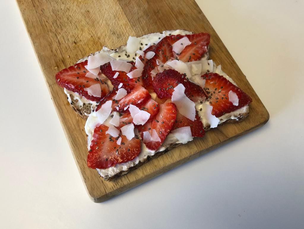 Greek Yogurt Toast · Organic 21 whole grain bread with non-fat greek yogurt, sweetened with light agave honey.
Topped with strawberries, coconut flakes and chia seeds.