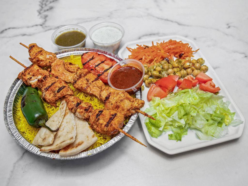Chicken Kebab Platter · Chef's Favorite Grilled Chicken Breast Skewers, W/Peppers, and onions Rice or Salad. Served with pita bread, chickpeas, carrot & raisins.