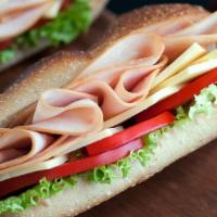 8. French Hero · Smoked turkey, French Brie cheese, lettuce, tomatoes and honey mustard.