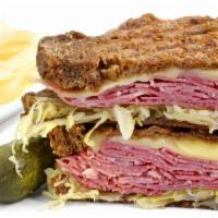 11. Classic Reuben · Grilled corned beef, sauerkraut, Swiss cheese and Thousand Island dressing on rye bread.