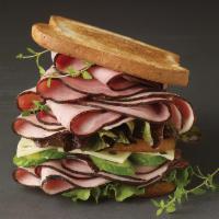 7. Woods Sandwich · Black forest ham, Alpine Lace cheese, sun-dried tomatoes, spinach and honey mustard.