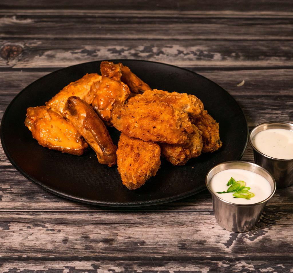 10 Piece Traditional Wings · Served with 2 flavors.