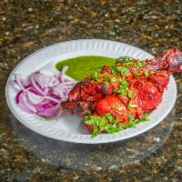 Tandoori Chicken · 2 pieces leg. Chicken leg pieces marinated in yogurt and house spices.