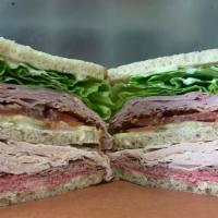 Deemer Dagwood Sandwich · Triple decker with ham, turkey, roast beef on rye bread with bacon, lettuce, tomato and pick...